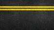 © ColorfulFlowerStudio - A top-down view of an asphalt road with yellow lines