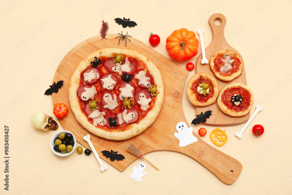 Composition with tasty pizzas, olives and decorations for Halloween on color background