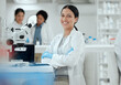 © KayExam/peopleimages.com - Laboratory, scientist or woman in portrait with arms crossed for science, medical expert and microbiology study. Career, female biologist or doctor with confidence for experiment, research and happy