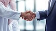 © TensorSpark - Arab and western businessmen shaking hands, symbolizing cross-cultural business agreement and arab investment.