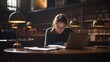 © Intania - Young Woman Working on Laptop in a Library