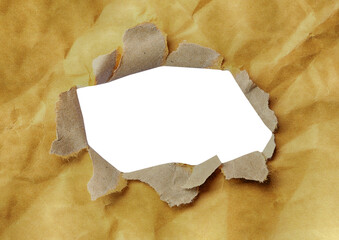 Crumpled and torn brown paper with gaps to reveal the art paper inside with transparent image of PNG format extension.