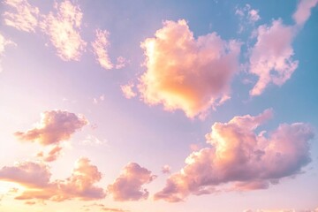 Wall Mural - Soft pink and yellow clouds paint the sky during a serene morning sunrise