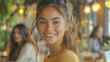 © Vertigo Images - Smiling woman with long brown hair in a cafe
