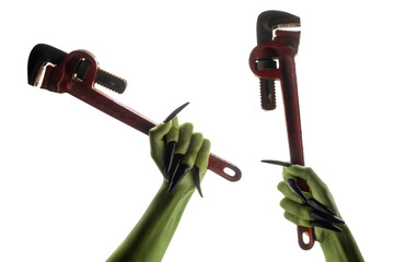 Wall Mural - Set of witches hands holding red pipe wrench. The hand color is green. Evil, zombie, or monster hand