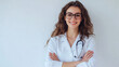 © EnioRBC - A beautiful female doctor, wearing glasses and a white lab coat with a stethoscope