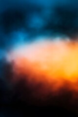 Wall Mural - Blue orange and black gradient background blurred