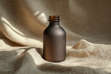 Wall Mural - Frosted Glass Bottle on a Textured Fabric Background