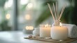 © Julia - Burning candles and aromatic reed freshener on table in spa salon, space for text