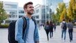 © khonkangrua - Smiling Young Man in Urban Setting with Backpack