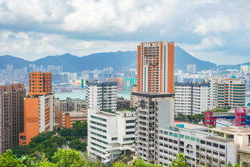 The crowded cityscape of Hong Kong residential area overlook Central and Kowloon island