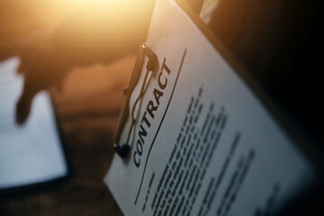 Business and lawyers discussing contract papers with brass scale on desk in office. Law, legal services, advice, justice and law concept picture with film grain effect