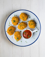 Wall Mural - Homemade chicken nuggets with tomato sauce. Top view table with decoration.