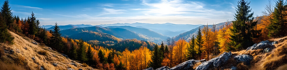 Beautiful autumnal view of the Carpathian Mountains. Autumn leaves on the trees. Rocks on the hilltop.