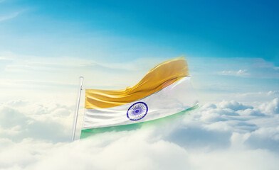 Wall Mural - India national flag hidden in the sky. The flag with drone shot in beautiful clouds. India national flag for independence day.