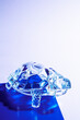 © ADDICTIVE STOCK - Blue and white gradient background with a crystal turtle