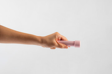 Canvas Print - Electric LED torch flashlight in hand isolated on a white background 