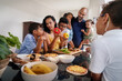 © Caia Image - Family preparing food in kitchen
