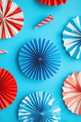 Set of festive red, white and blue party napkins or wreath decorations made from colorful paper with fringes.