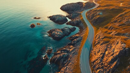 Road and rocky coastline with waves and pebbles seen from above in the Lofoten Islands, Norway, at dusk. scenery featuring a stunning road, clear blue water, and rocks. 