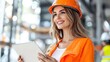© Jiranath - Female Construction Worker Holding Tablet