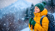 © Tanya - Happy smiling woman in yellow jacket and green hat with a backpack and hiking poles enjoying a winter hike in the mountains. Active lifestyle. Copy space.
