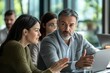 © mohdfaizal - Business Meeting:  A Man Explains a Concept to a Woman