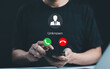 © Supatman - Fraud and phishing concept. Man holding mobile phone with incoming call from unknown caller. scammer or stranger, Hoax person with fake identity, Prank caller, anonymous, smartphone, unwanted, spam,
