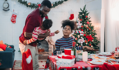 Wall Mural - Joyful Black Family Christmas Dinner