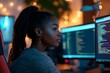 © Archibalttttt - Focused african american programmer working on computer code at night