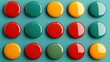 © Benjawan - A vibrant arrangement of colorful circular buttons featuring red, yellow, green, and teal hues against a textured turquoise background, Business idea concept.