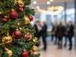 © zphoto83 - The Christmas tree adorned with vibrant red and gold ornaments stands prominently as people engage in conversation in the blurred background during a festive holiday event