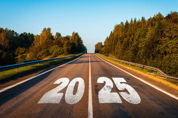 text 2025 written on the road in the middle of asphalt road with at sunset. new year 2025 or straigh