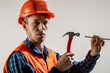 © Yevhen - Handyman at work. Handymen using hummer while working. Repairman in helmet nailing with the help of hammer. Man builder. Hammer hammering. Hammer hand nail. Builder in helmet, hammer, handyman