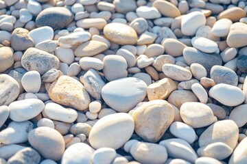 A top view of small pebbles on the beach.