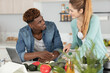 © auremar - couple cooking following recipe application on tablet