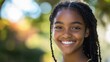 © ChaoticMind - A young child with braided hair smiles warmly at the camera, standing in a sunlit garden, exuding joy and innocence against a blurred nature background.