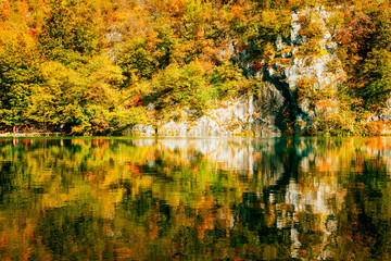 Wall Mural - Stunning Autumn Landscape with Vibrant Foliage Reflection on Water