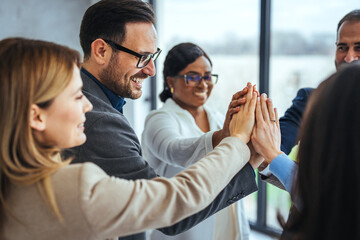 Diverse Team Celebrating Success with a Group High-Five