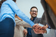 © Dragana Gordic - Team Celebrating Success with a Group Handshake