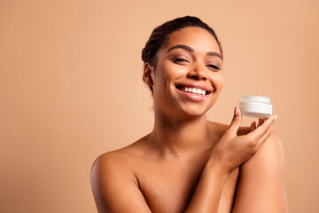 Poster - Photo of stunning dreamy lady hold cream jar bare shoulders isolated on beige pastel color background