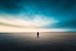 © Guy - Man Standing Alone in a Vast Desert Landscape
