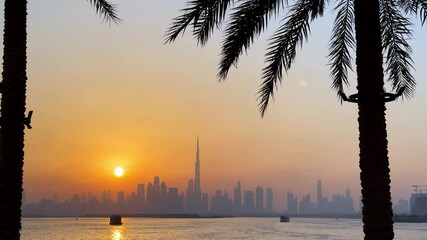 Wall Mural - amazing sunset view of Dubai Downtown cityline from Dubai Creek harbour