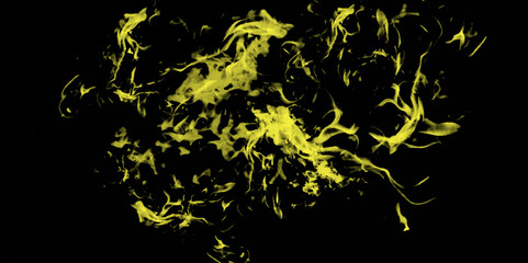 golden fire on a black background . Chaotic mixing smoke creates abstract patterns on a black background .abstract black background with green smoke and copy 