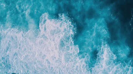 Wall Mural - Aerial view of ocean waves creating a mesmerizing pattern in turquoise waters.