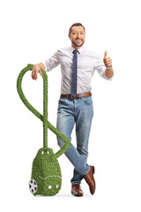 Sticker - Man leaning on a green eco friendly vacuum cleaner and gesturing thumbs up