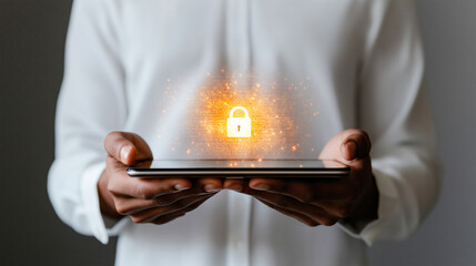 Protecting personal data is crucial in todays digital age, as depicted by businessman holding tablet with glowing lock symbol. This image emphasizes importance of data security and privacy