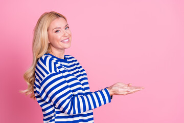 Canvas Print - Photo of lovely pretty woman wear stylish striped clothes hold empty space isolated on pink color background