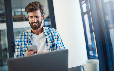 Wall Mural - happy man, thinking and typing on cellphone for networking, communication or message in office. desi