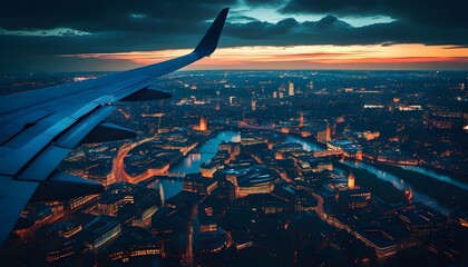 Wall Mural - Aerial View of London at Night with City Lights, Airplane Wing, and Sunset Skies